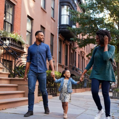 Family Walking Down Street