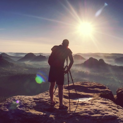 Man Standing On Mountain