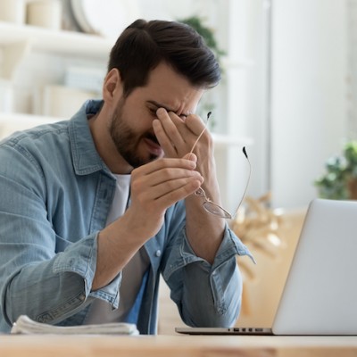 Sad Man On Laptop