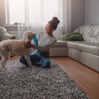 Teen Playing With Dog