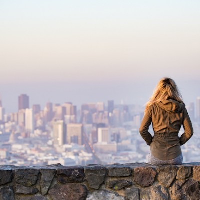 Woman Watching City Skyline