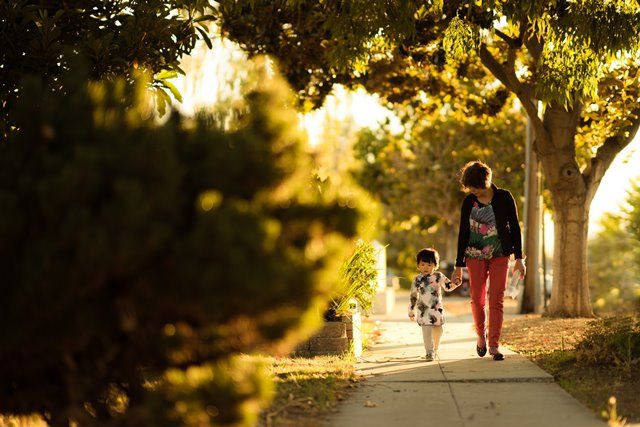 family walking outside compressor